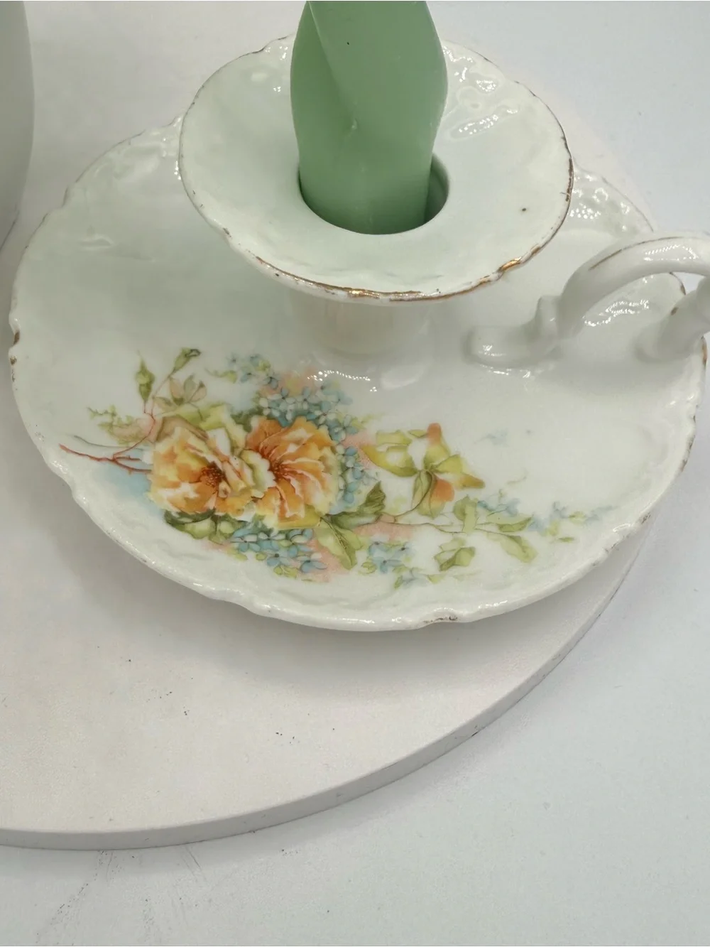 Vintage porcelain taper candle stick holder with floral motif and gold edging